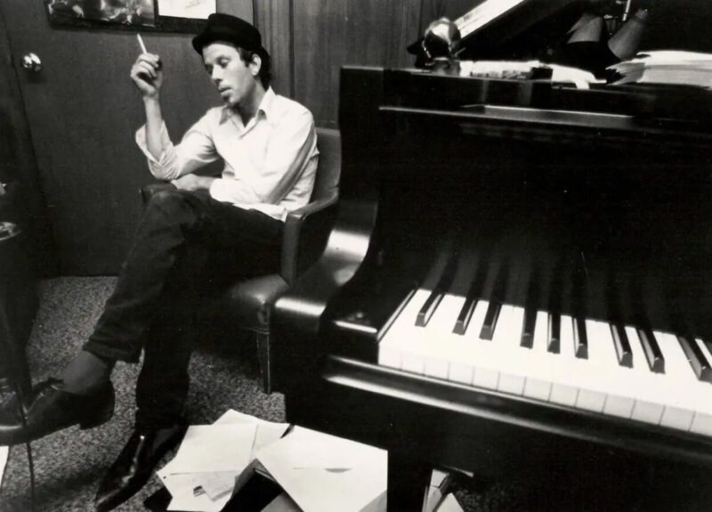 Tom Waits sitting by the piano, "One From the Heart" sessions